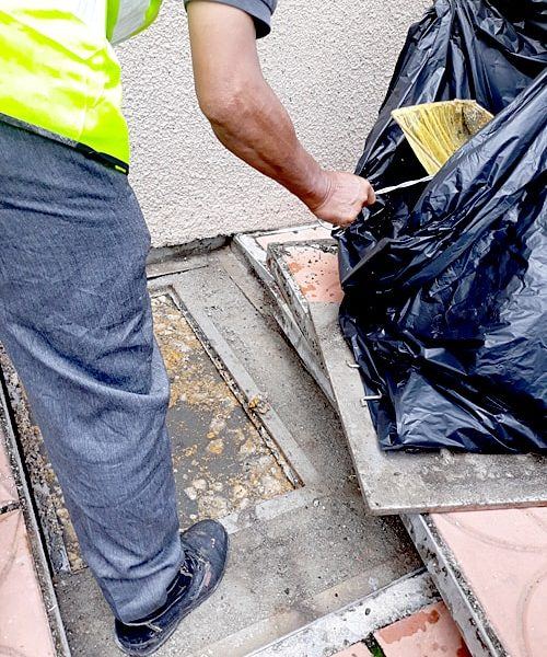 Sludge removal from grease trap